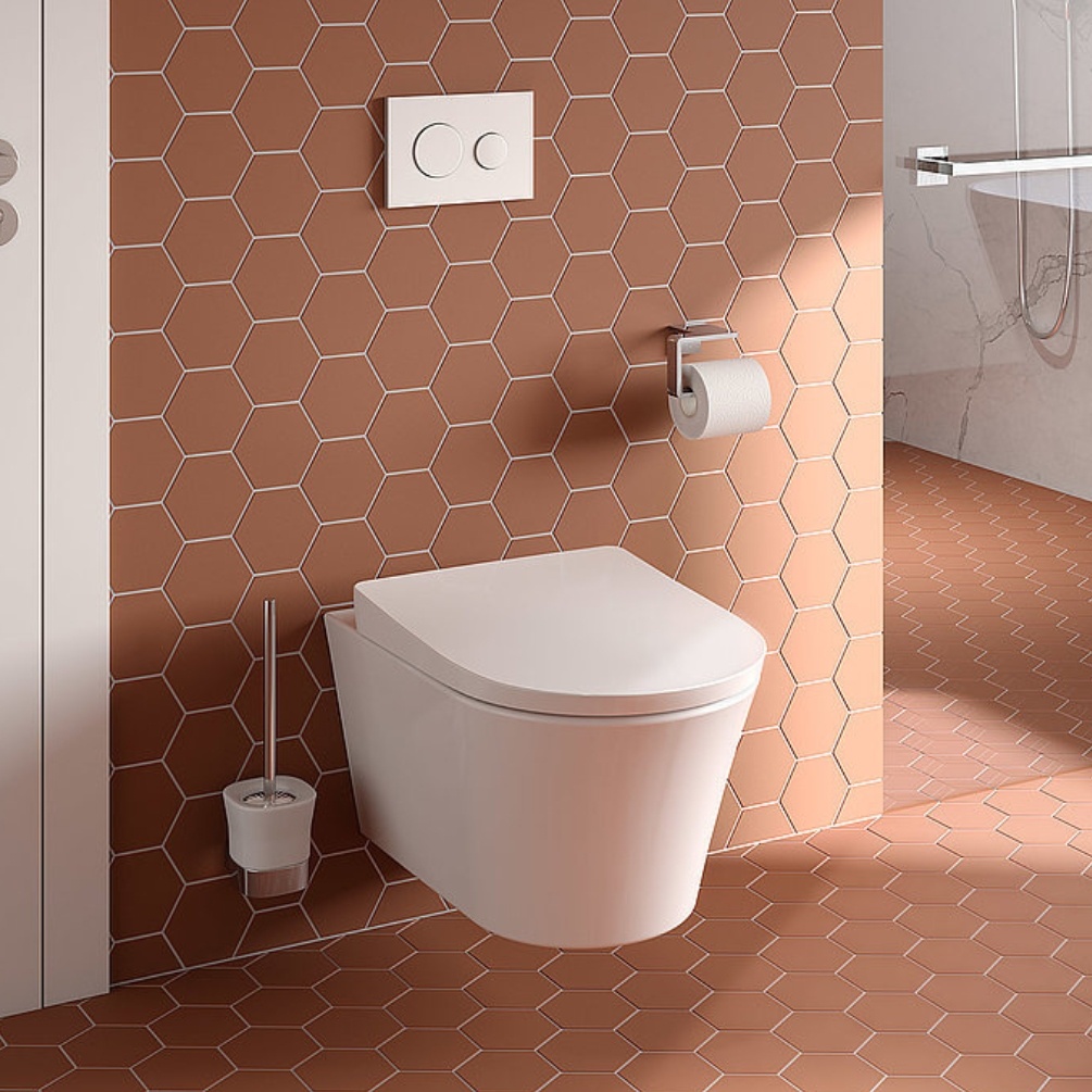 Lifestyle image of the TOTO GP Wall Hung Rimless Toilet mounted on a tiled bathroom wall